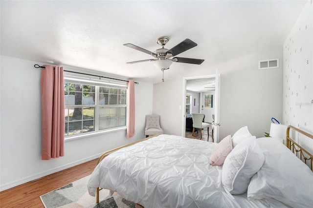 6801 16th St N, Saint Petersburg, FL 33702 - bedroom featuring a ceiling fan, visible vents, wood finished floors, and baseboards