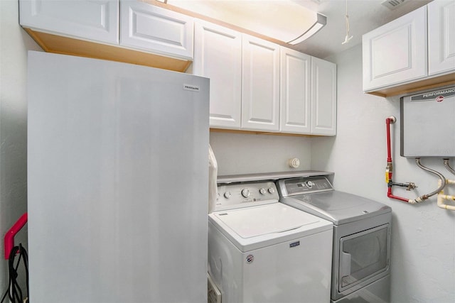 6801 16th St N, Saint Petersburg, FL 33702 - washroom with cabinet space and washer and dryer