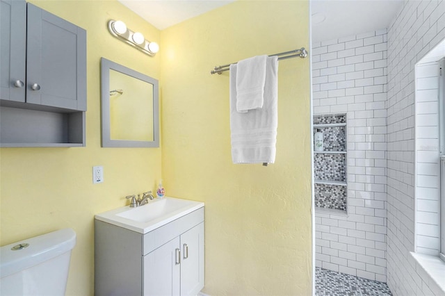 6801 16th St N, Saint Petersburg, FL 33702 - full bathroom featuring vanity, toilet, and a tile shower