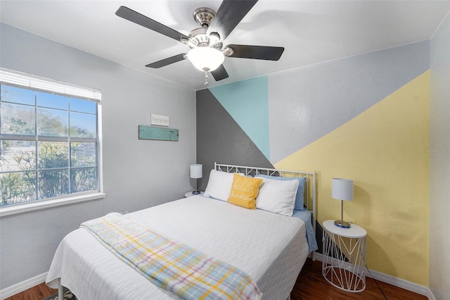 6801 16th St N, Saint Petersburg, FL 33702 - bedroom with multiple windows, wood finished floors, and baseboards