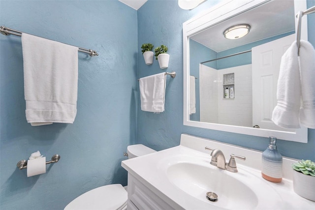 6801 16th St N, Saint Petersburg, FL 33702 - bathroom featuring walk in shower, toilet, and vanity