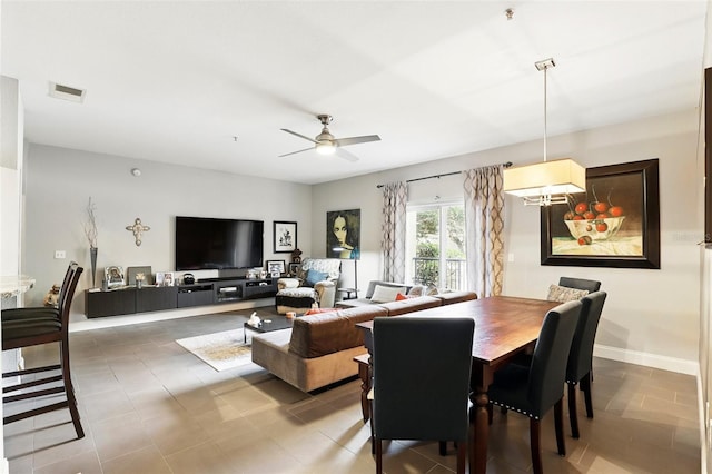 dining space with ceiling fan and visible vents