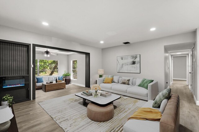 2014 10th St NW, Winter Haven, FL 33881 - living area with recessed lighting, baseboards, visible vents, and light wood-style floors