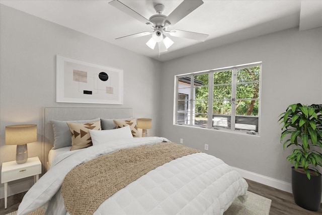 2014 10th St NW, Winter Haven, FL 33881 - bedroom with a ceiling fan, baseboards, and dark wood finished floors