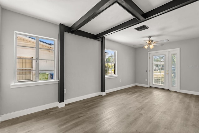 2014 10th St NW, Winter Haven, FL 33881 - interior space featuring ceiling fan, baseboards, beam ceiling, and wood finished floors
