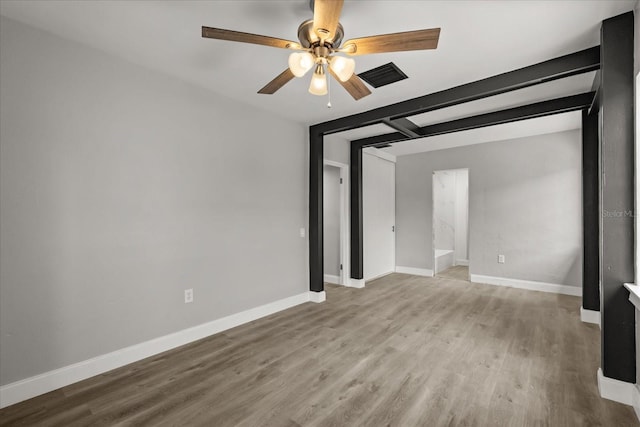 2014 10th St NW, Winter Haven, FL 33881 - empty room featuring a ceiling fan, baseboards, visible vents, and wood finished floors
