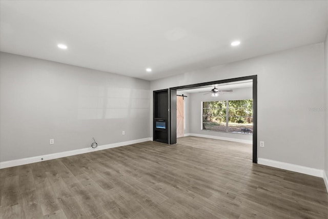 2014 10th St NW, Winter Haven, FL 33881 - spare room featuring recessed lighting, baseboards, and wood finished floors