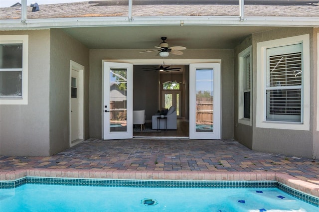 4837 Lorraine Way, Orlando, FL 32812 - property entrance with a ceiling fan, an outdoor pool, a patio area, and stucco siding