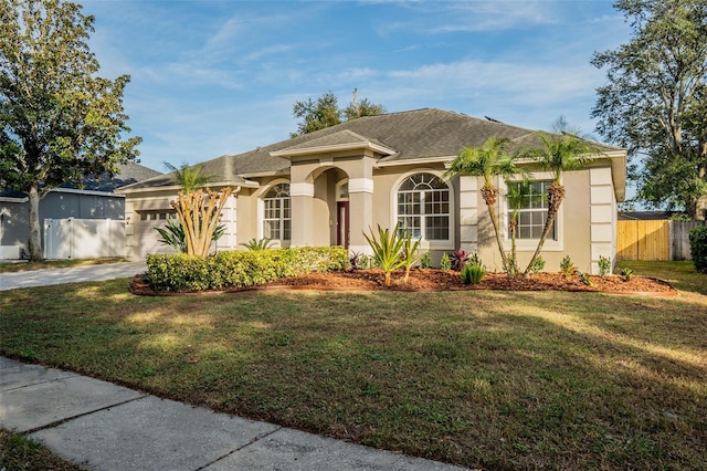 4837 Lorraine Way, Orlando, FL 32812 - single story home with an attached garage, driveway, a front yard, and stucco siding