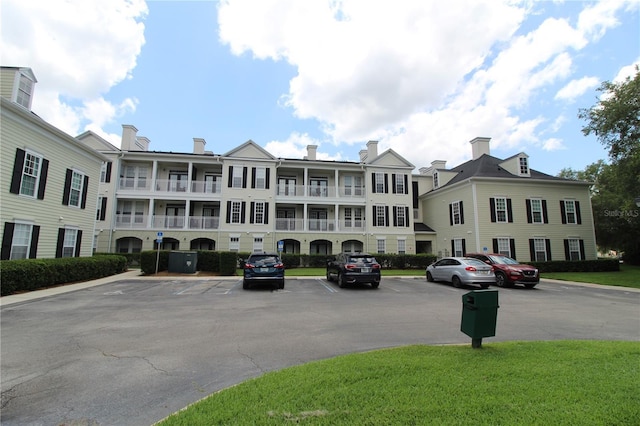 view of property with uncovered parking