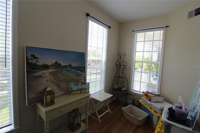 interior space with visible vents and wood finished floors