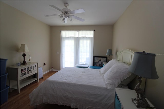 bedroom with baseboards, ceiling fan, and wood finished floors