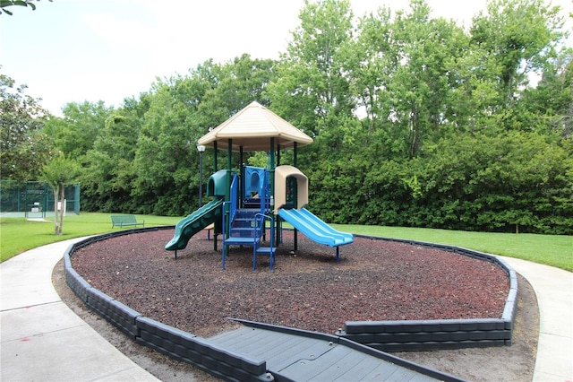 community play area with a lawn