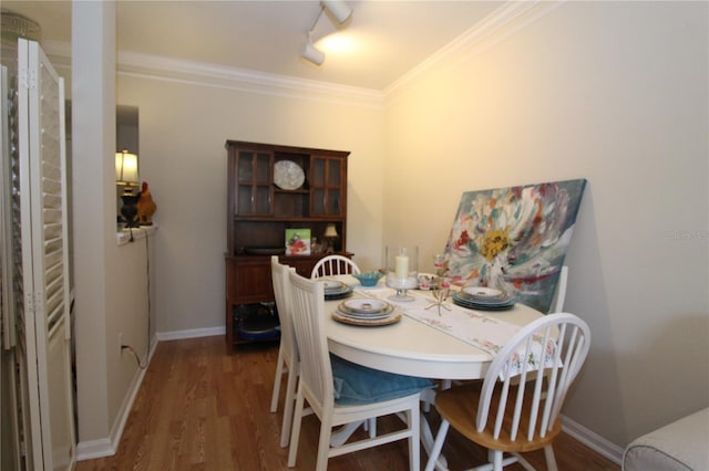 280 Celebration Blvd Unit 208, Kissimmee, FL 34747 - dining area with dark wood finished floors and ornamental molding