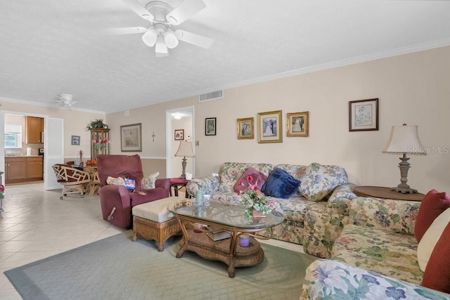 4262 Lake Underhill Rd Unit 9C7, Orlando, FL 32803 - living room with ceiling fan, light tile patterned flooring, a textured ceiling, and ornamental molding