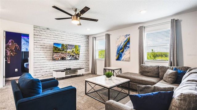 living room featuring baseboards, carpet flooring, and ceiling fan