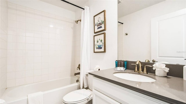 bathroom with vanity, toilet, and shower / tub combo