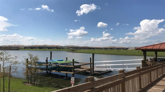 dock area with a water view and boat lift
