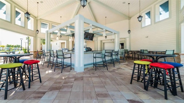 view of patio featuring a ceiling fan and outdoor dry bar