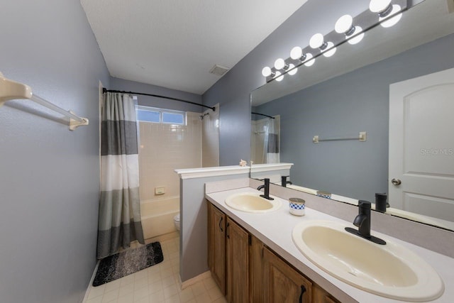 full bathroom with toilet, shower / bath combo, visible vents, and a sink