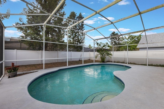 view of swimming pool featuring a patio area, a lanai, a fenced backyard, and a fenced in pool