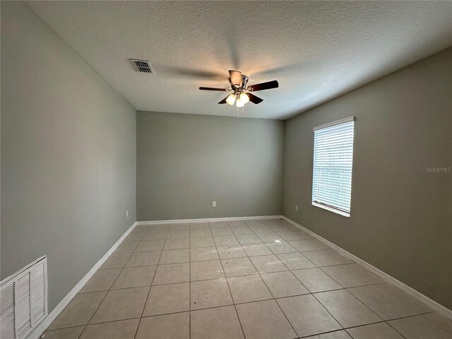 13344 Great Plains Dr S, Riverview, FL 33579 - unfurnished room with a textured ceiling, a ceiling fan, light tile patterned flooring, and visible vents