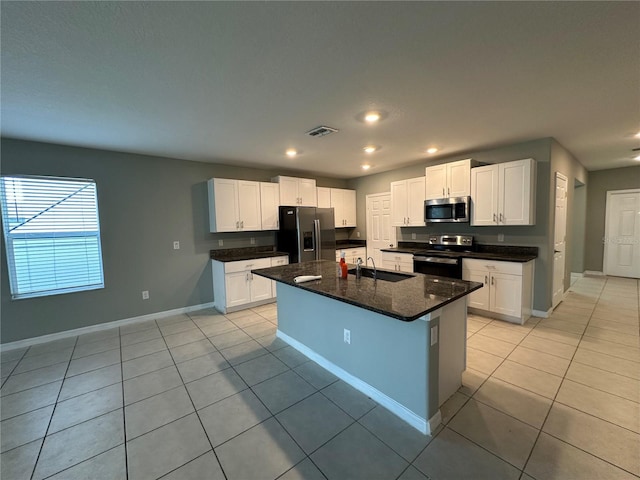 13344 Great Plains Dr S, Riverview, FL 33579 - kitchen featuring light tile patterned flooring, a sink, stainless steel appliances, baseboards, and visible vents