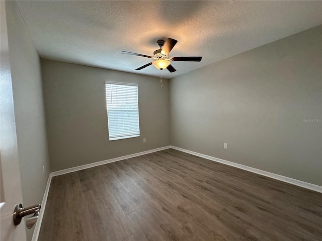 13344 Great Plains Dr S, Riverview, FL 33579 - empty room featuring baseboards, a textured ceiling, dark wood-style flooring, and ceiling fan
