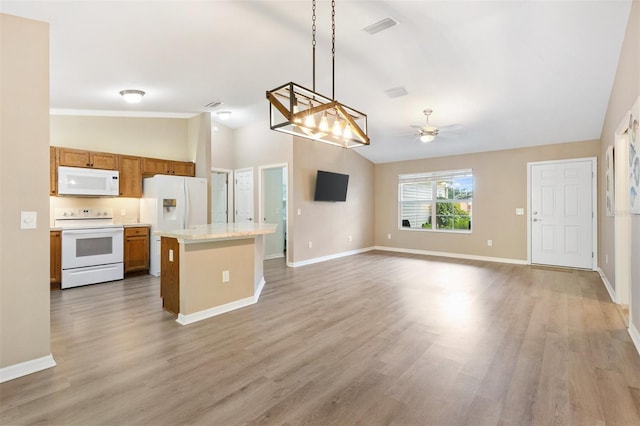 kitchen featuring white appliances, a ceiling fan, lofted ceiling, light wood-type flooring, and visible vents