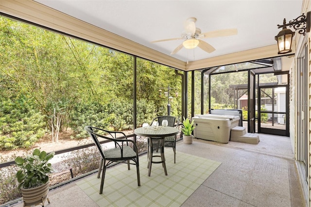 sunroom featuring ceiling fan