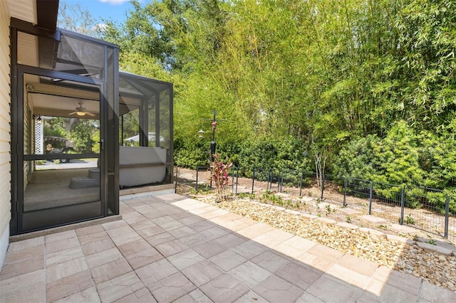 view of patio / terrace with fence and a lanai