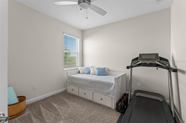 carpeted bedroom featuring baseboards and a ceiling fan