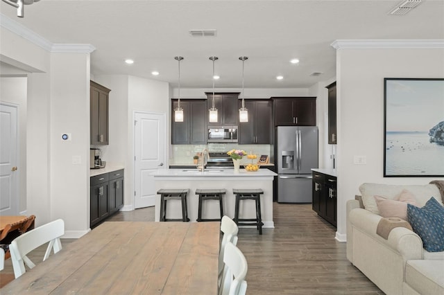 kitchen featuring visible vents, light countertops, and appliances with stainless steel finishes