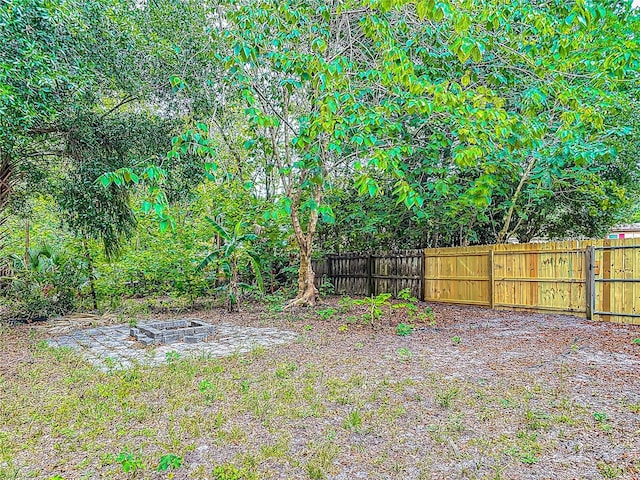 499 W Beresford Rd, Deland, FL 32720 - view of yard featuring fence and a fire pit