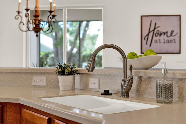 details with a sink and backsplash
