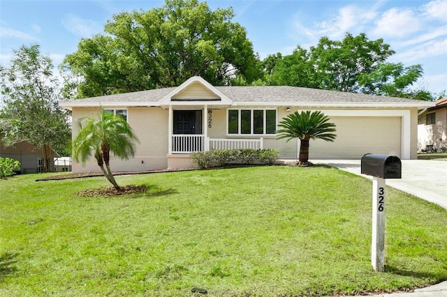 ranch-style house featuring a garage, covered porch, driveway, and a front yard