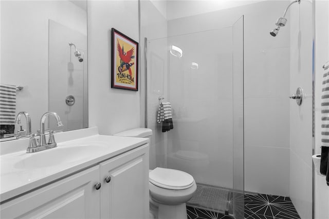 full bath with vanity, a walk in shower, and toilet