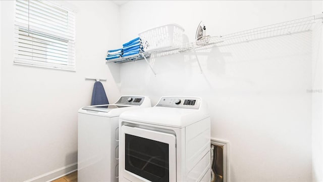 2936 Protagonist St, Kissimmee, FL 34746 - laundry room with separate washer and dryer, baseboards, and laundry area