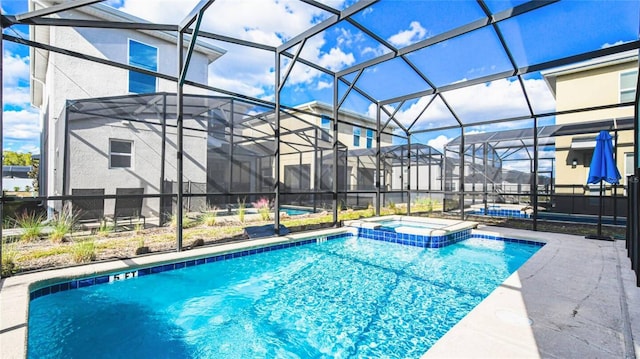 2936 Protagonist St, Kissimmee, FL 34746 - view of swimming pool with a patio, a pool with connected hot tub, and glass enclosure