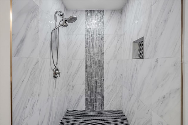 full bathroom with tiled shower