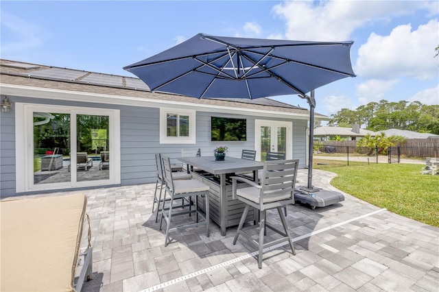 view of patio with fence and outdoor dining area