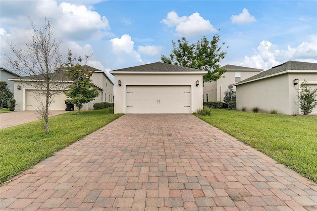 single story home featuring decorative driveway, stucco siding, and a front yard