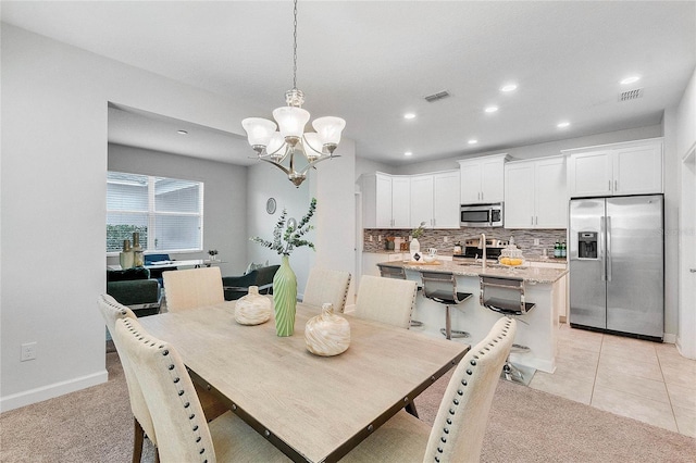 dining space with recessed lighting, a notable chandelier, and visible vents