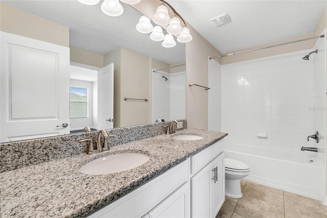 bathroom featuring visible vents, a sink, shower / bathtub combination, and toilet