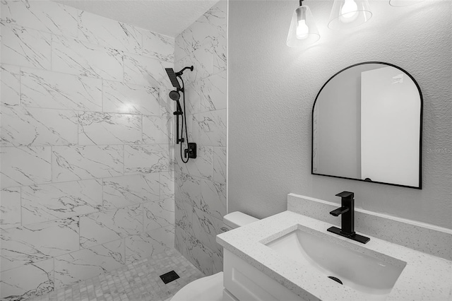 2105 9th St NE, Winter Haven, FL 33880 - full bathroom featuring vanity, toilet, a shower stall, and a textured wall