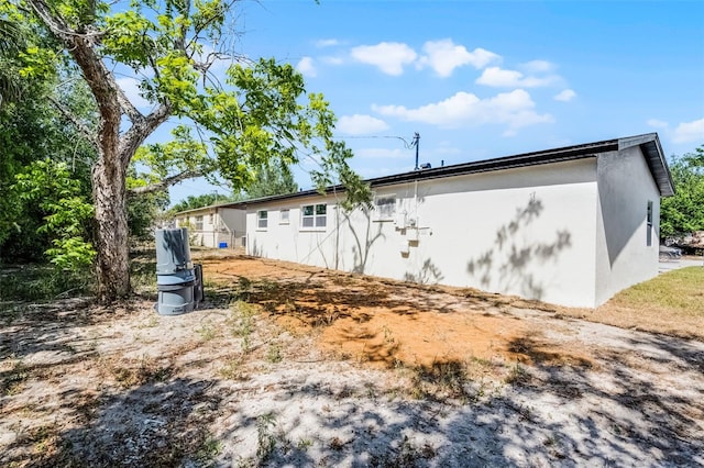 2105 9th St NE, Winter Haven, FL 33880 - view of side of property with stucco siding