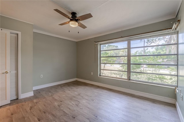 1108 Gibson St, Leesburg, FL 34748 - unfurnished bedroom featuring light wood-type flooring, baseboards, crown molding, and a ceiling fan