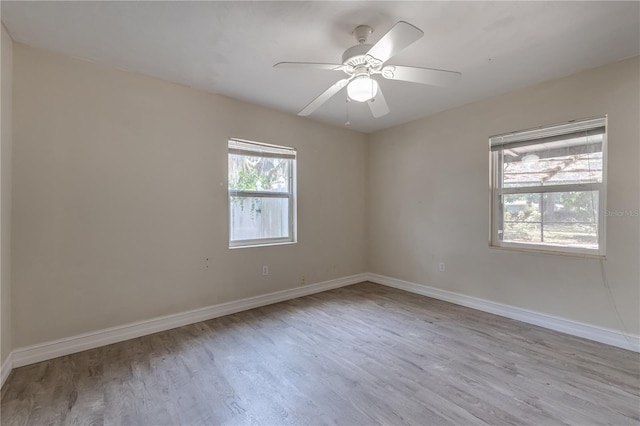 1108 Gibson St, Leesburg, FL 34748 - empty room featuring wood finished floors, baseboards, and a ceiling fan