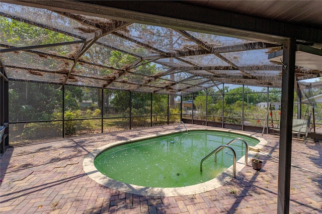 1108 Gibson St, Leesburg, FL 34748 - swimming pool featuring a patio and glass enclosure