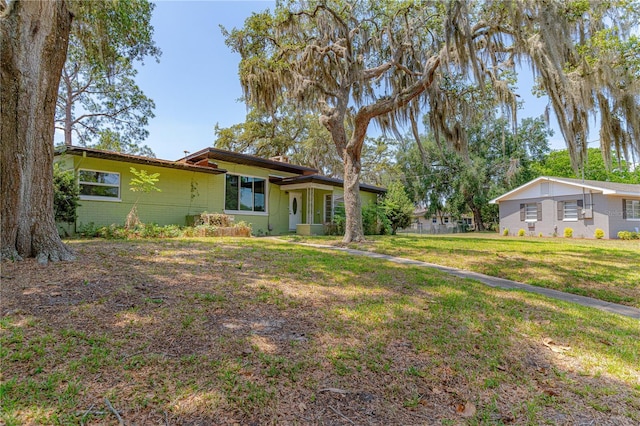 1108 Gibson St, Leesburg, FL 34748 - view of front of house featuring a front lawn and brick siding